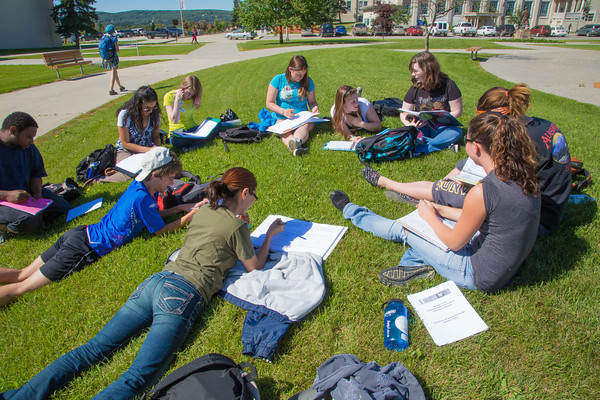 Ͷע students attend a summer class outdoors on the Fairbanks campus